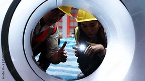 Female engineer metal worker industrial experienced operator technician worker checked in working on lathe machine with clipboard, professional woman in industry technology manufacturing factory.