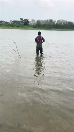 The river water level is low, making it easier to cast nets and catch fish