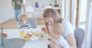Mother and daughter sitting at the dining table