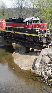 Youngstown & Southeastern train crosses a bridge and road in fashion. They make sure everyone hears them coming. #reels #amazing #viral #trains | Eric’s Train Yard