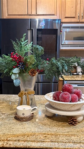 ⭐ Liza | Cozy Modern Home Decor + DIYs on Instagram: "Winter kitchen styling doesn’t have to be complicated ❄️ Just greenery, texture, and a few simple layers. This little moment on my island makes the whole space feel warm + festive without feeling overdone. ✨ Tip: mix something natural (greens), something cozy (candle), and something grounded (stone/wood) for an elevated look. Save this for easy winter kitchen inspo 🤍 Which piece are you loving most — the greens or the bowl of apples? Follow•