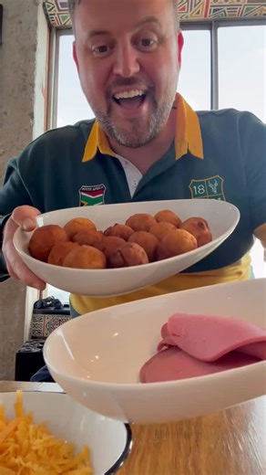 I’m Nick Hamman and I want to know if there’s a more iconic South African breakfast than Magwinya, with cheese and polony. Whether you know them as Magwinya vetkoek, fat cake or any other name, this is deepfried dough, soft inside, crispy on the outside and the fuel of so many people, best enjoyed with a cup of coffee and before you drag me in the comments, yes ideally with atchar. Making up for that though I enjoyed mine on top of ponte tower with dlala nje where I broadcast my national breakfa