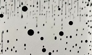 Abstract black paint drips on a light beige background, creating a striking visual texture that captures the essence of modern art and minimalism with ai generated.