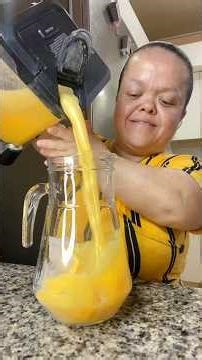 Fresh carrot, mango and pineapple juice