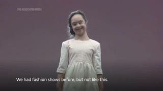 Dozens of models with Downs syndrome take to the catwalk at Bucharest fashion show