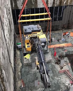 1.1K views · 28 reactions | 113,000lbs of excavator being craned out of a 100ft deep hole! — For this new 58 story high rise building, the foundation footings were excavated to a depth of 100ft below street level. — The dig progressed in 6 foot lifts, shoring the excavation walls with shotcrete and ground anchors. The final stages involve the removal of the two excavators from the excavation so construction of the high rise can continue | Earthmovers Media | Facebook