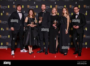 Associated Press photographer Evgeniy Maloletka, from left, PBS editor-in-chief of frontline and producer Raney Aronson, director, producer and AP journalist Mstyslav Chernov, editor and producer Michelle Mizner, field producer and AP video journalist Vasilisa Stepanenko, and producer and AP vice president and head of production Derl McCrudden, winners of the documentary award for '20 Days in Mariupol', pose for photographers at the 77th British Academy Film Awards, BAFTA's, in London, Sunday, F