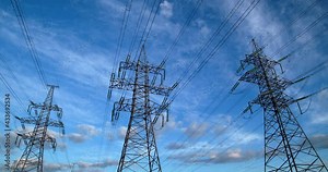 High voltage power transmission towers. Large electric pylons.