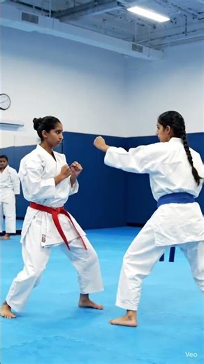 Female Karate Duel –Two athletic women in karate