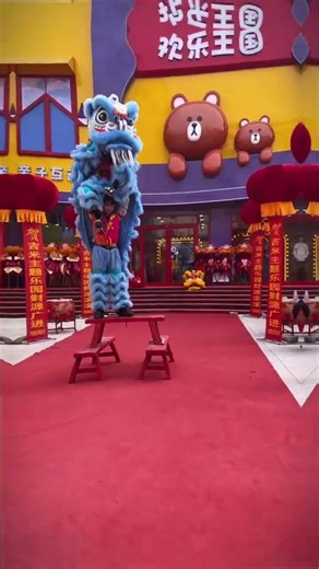 Cute Lion Cub Dances Alongside Traditional Drums in Lion Dance Performance