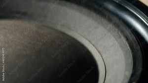 Acoustic sound system close-up. Loud music volume macro shooting. Professional disco studio equipment subwoofer. Playback of musical stereo system, vibration.