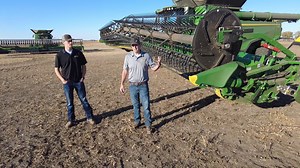 Jim Vasichek and Kaden Martinson provide a walkaround on the John Deere HDF Hinged Flex Draper. The HDF adjusts to the ground, floating over the field for a more consistent cut. Capture more crops with a close and consistent reel-to-cutterbar clearance, improved reel torque and Grain Saver Draper Belts. | Leading Edge Equipment