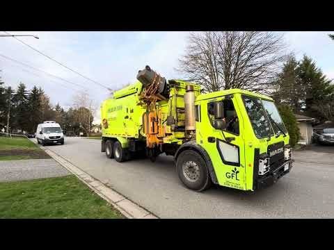 2 GFL Mack LR garbage trucks on trash and greens.