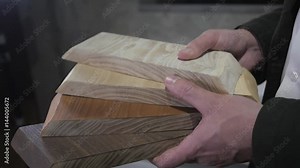 Kitchen cabinets and countertops, wood door and stone surface color samples in designer hands Stock Video