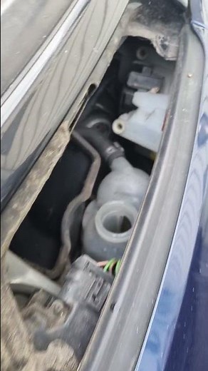 Where do I refill the coolant in my Smart Fortwo?