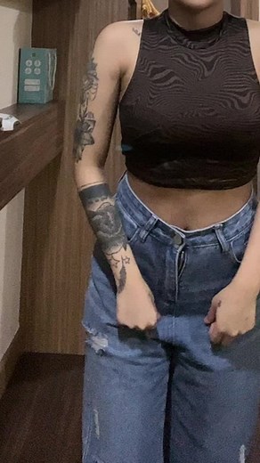 Intricate Floral Tattoos on a Stylish Woman