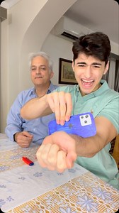 PHONE THROUGH ARM TUTORIAL 😱😂 #magic #magictrick #phone #tutorials | Milaad Khodadoust