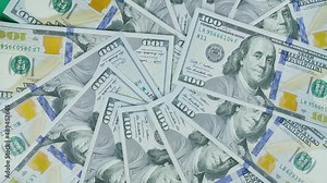 The dollar on the turntable. The dollar spin rotate. Twist, create pattern, make design shape circle.