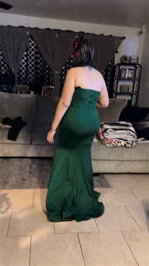 ✨Behind The Sparkle With Lady De….✨ “ When you’ve filmed so manny clips and retake after retake, changed earrings and dresses 10 times, TRY TO 😜posed like a whole Hollywood queen… and now you’re just a glamorous burrito on the couch with a drink. 😂💚 Behind all the sparkle & magic is a tired designer in slippers trying to figure out what to do next, but honestly? I love every second of creating for you and working with my son and husband. ✨💋 #LadyDeMagic #BehindTheScenes” | Lady De Couture