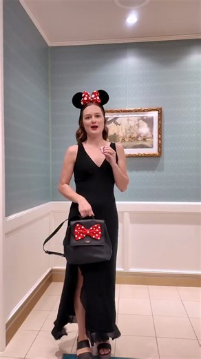 Minnie Mouse Outfit for 1923! ❤️👗(Dinner on the Disney Wish) This is the outfit I wore to dinner at 1923 on the Disney Wish! I wore a fancy Minnie Mouse-inspired outfit with a black dress, Croc wedges, Minnie Mouse ears, a Kate Spade backpack, and earrings. What would you wear on the Disney Wish?! #outfit #minniemouse #disney #disneyoutfit #disneywish @disneycruiseline @disneystyle @katespadeny @crocs @disneystore @maccosmetics | Megan Moves