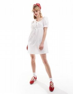 Reclaimed Vintage milkmaid mini dress with puff sleeve in white | ASOS