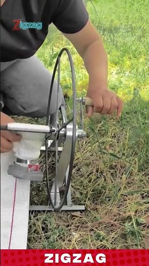 Worker Using a Hand Crank Machine to Roll and Prepare Long Tape Strips