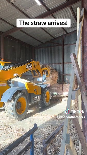 Unloading Long Straw for Thatched Roofing Project
