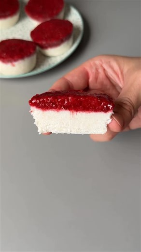 @tastyiri_en on Instagram: "FROZEN COCONUT & STRAWBERRY DESSERT 🍓🥥🤤 INGREDIENTS: ▪️ 5.6 oz shredded coconut ▪️ 2.8 oz canned coconut milk (thick part) ▪️ 1 tbsp honey ▪️ 10.5 oz frozen strawberries ▪️ 1 tbsp chia seeds ⏳ Time: 3–4 hours in freezer STEPS: 1️⃣ Slightly heat the frozen strawberries until softened, then mash them with a fork. 2️⃣ Blend shredded coconut with the thick part of the coconut milk and honey until creamy. 3️⃣ Mix the mashed strawberries with chia seeds. 4️⃣ In a mold, l