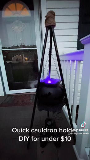 Here’s how i made a stand for my cauldron with dollar tree products . Items needed: 3 broom sticks, 1 garden plant hanger (just the chains and top hook) 1 frying pan grease lid, zip ties, rope and creepy cloth! #halloween #halloween2022 #halloweendiys #halloweendecor #halloweendecorations #dollartree #dollartreediy #dollartreefinds #dollartreehalloween2022 #halloweenlook #halloweeninspo #halloweeninspiration #halloweeninspo2022 #halloweenvibe #falloween2022❤️ #falloween #codeorange #codeorange20