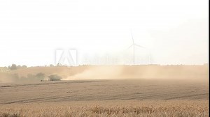 Harvesting wheat during the war. Wheat ears close-up. Harvesting in Ukraine. Harvester in a wheat field. War in Ukraine. Wheat field. Food concept. Problems with the export of Ukrainian grain. Stock Video