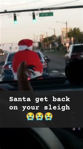 what is Santa doing on the motorcycle?😅