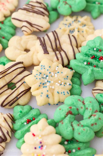 Comment COOKIES if you want me to send you this recipe! ✨ Please tell me I’m not the only one who eats these by the handful?! 😂 �Spritz Cookies are truly the unsung heroes of holiday baking. Just 6 simple ingredients, a cookie press, and suddenly you’ve got a whole tray of the cutest, softest, buttery little cookies you’ve ever seen. They hold their shape beautifully (no spreading!), they’re SO fun to decorate, and you can make every single one a little different… which basically means you get