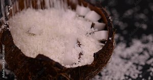 white coconut pulp and dried coconut flakes, a close-up of which is used in the preparation of desserts