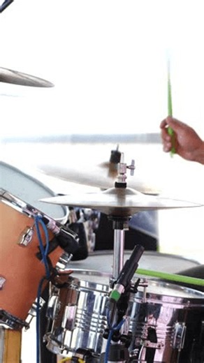 clip-4137259797-dynamic-action-shot-drummer-playing-live-bright