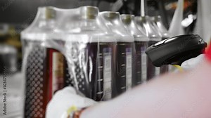 Barcode scanning and quality control on automated beverage bottling line.