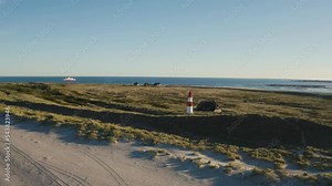 Sylt, Lighthouse Ellenbogen, Northernmost point of Germany. Schleswig-Holstein, North Sea. 4K drone. Beautiful tourist destination and attraction from above.