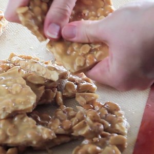 One of my most popular recipes for the holidays! Grab some of this Easy Microwave Peanut Brittle! RECIPE HERE --> http://www.julieseatsandtreats.com/microwave-peanut-brittle-recipe/ | Julie's Eats & Treats - Easy, Family Friendly Recipes