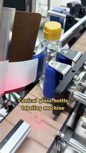 Conical glass bottle labelina machine