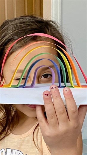 Here is an easy rainbow craft to make with your kiddos! #rainbowcrafts #rainbowart #constructionpaper #easykidscrafts #kidscraft #craftsforkids #papercraftsforkids | Construction Paper Crafts for Kids