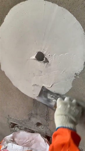 Use the putty knife to create a neat circular shape on the wall putty. #construction #installation