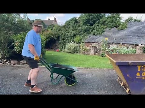 How to empty a wheelbarrow into a skip on your own.