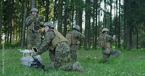 Army engineer using drone to monitor enemy and complete military action