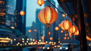 Download Chinese traditions and culture celebrated with red and gold paper lanterns illuminating the hong kong skyline at night Chinese New Year for free