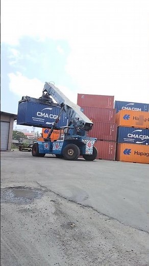 Kalmar Reach stacker with a tilting spreader for container handling