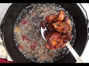 Traditional Mexican Pork Carnitas in a Cast Iron Pot