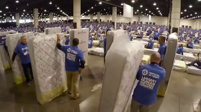 22M views · 21K reactions | World record toppled for largest human-mattress dominoes: www.cbc.ca/1.3527204 | CBC News | Facebook