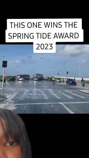 Spring Tide Event: Vehicles and People Navigating Flood