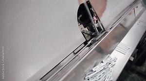 Automatic line in Factory for UPVC windows and doors production. Process of manufacturing a remote frame for plastic windowsFactory Work on the production of PVC windows. UPVC window production techno