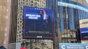 Scott LoBaido appears on Trump MSG rally stage with Empire State Building painting