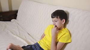 clip-23086540-boy-biting-his-nails-obsessive-compulsive-disorder-child